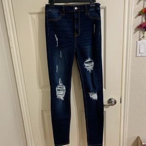 Dark washed, high waisted, skinny jeans.